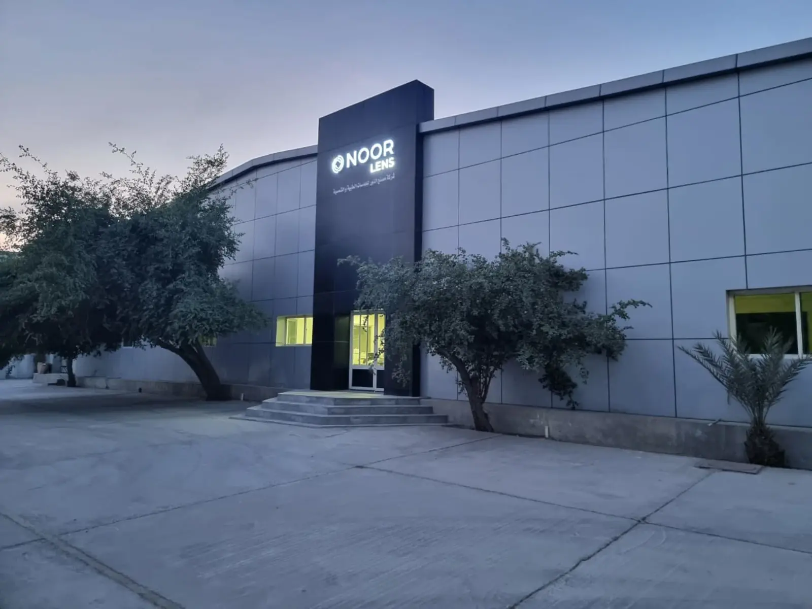 Inside the Al Noor Lens laboratory in Dammam — free-form lens surfacing with German optical machinery.